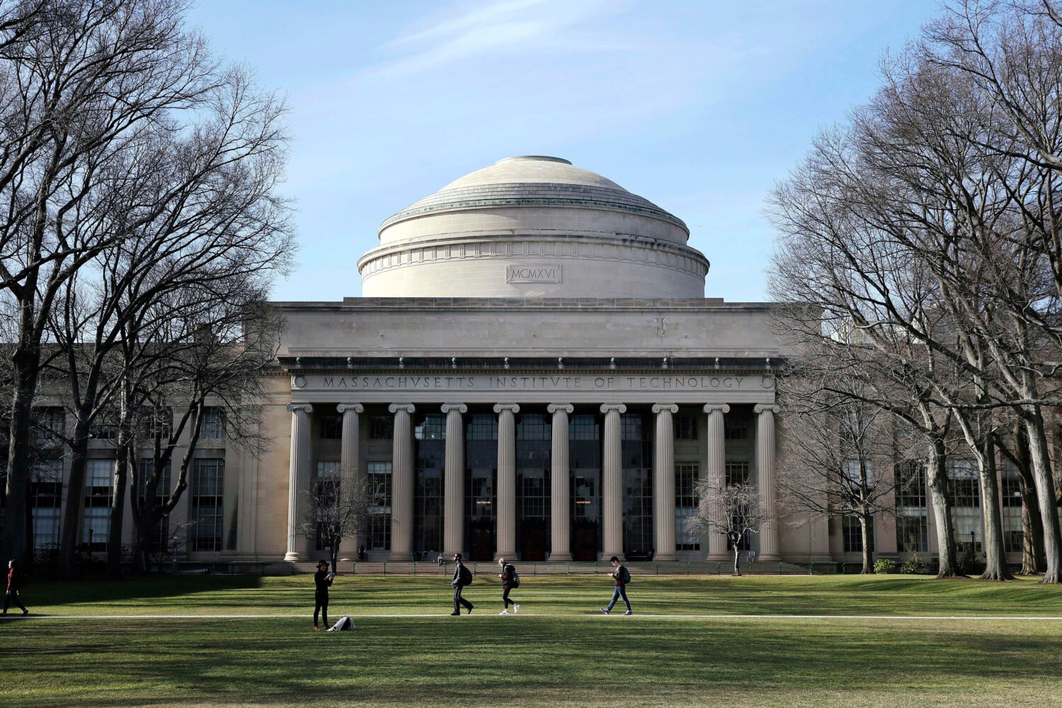 FILE - Students walk past the "Great Dome" atop Building 10 on the Massachusetts Institute of Techn...