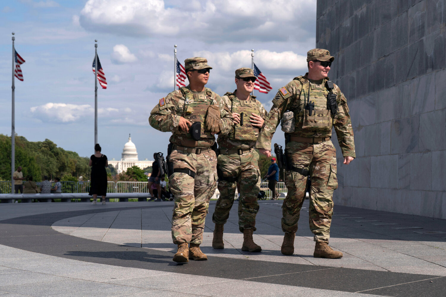 FILE - Members of the Louisiana National Guard patrol the grounds of the Washington Monument at the...