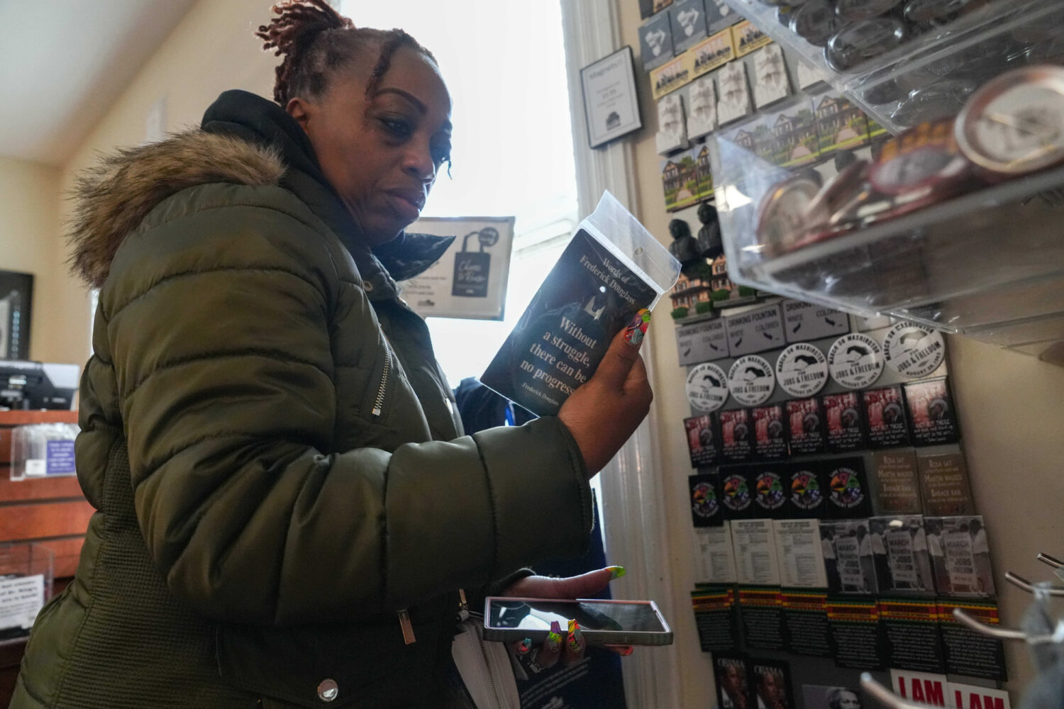 Keisha Burse looks at items for sale at Martin Luther King Jr. National Historical Park, Tuesday, D...