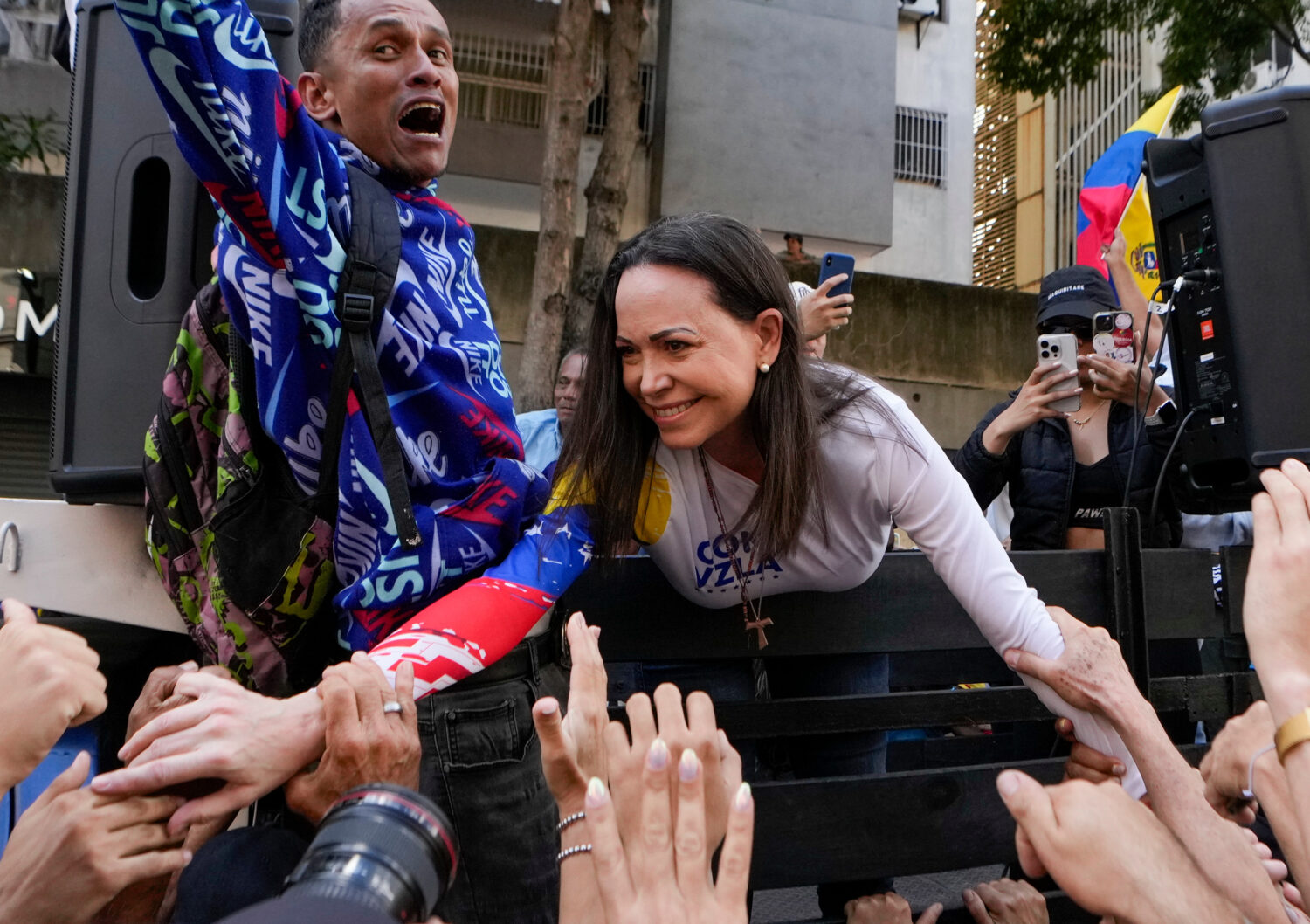 FILE - Opposition leader Maria Corina Machado greets supporters during a protest against Venezuelan...
