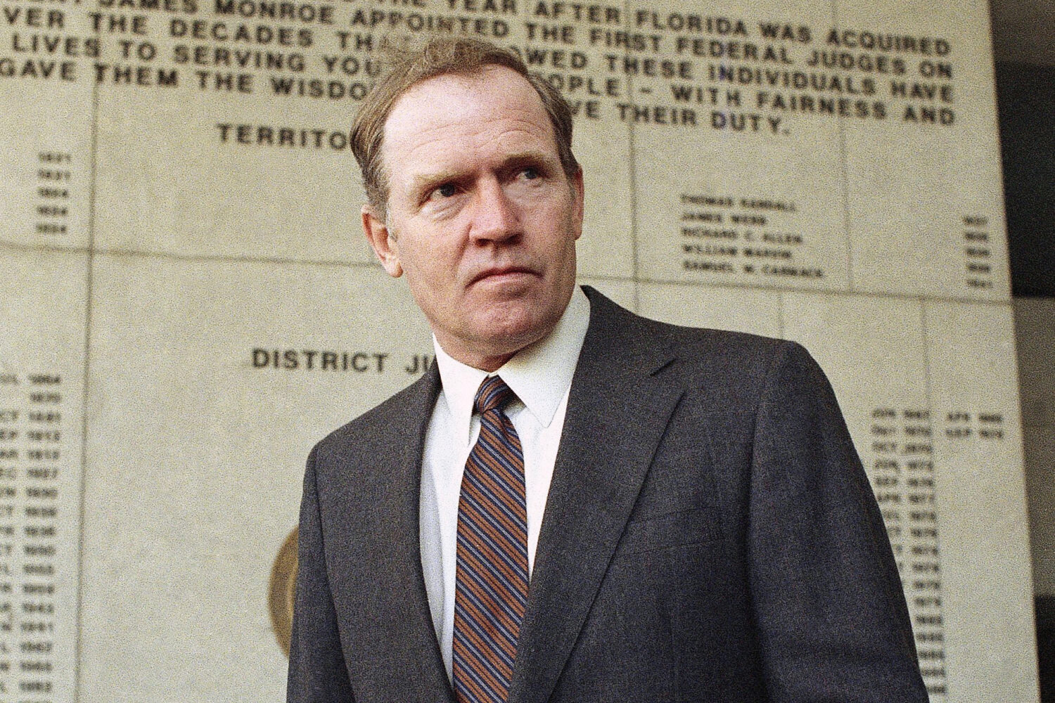 FILE - Eugene Hasenfus stands outside U.S. District Court in Miami, Tuesday, Dec. 13, 1986 after ap...