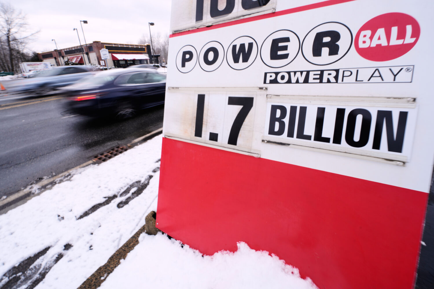 The jackpot for the Powerball lottery game is displayed outside Ted's State Line Mobil station, Wed...