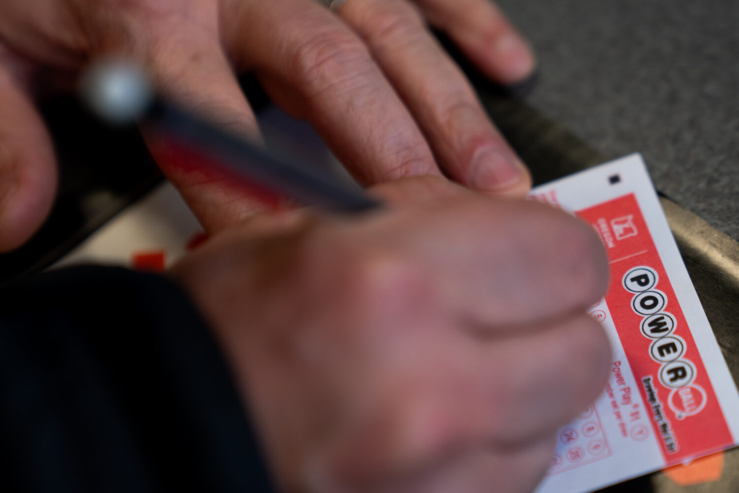 A person fills out a Powerball lottery ticket on Monday, Dec. 22, 2025, in Portland, Ore. (AP Photo...