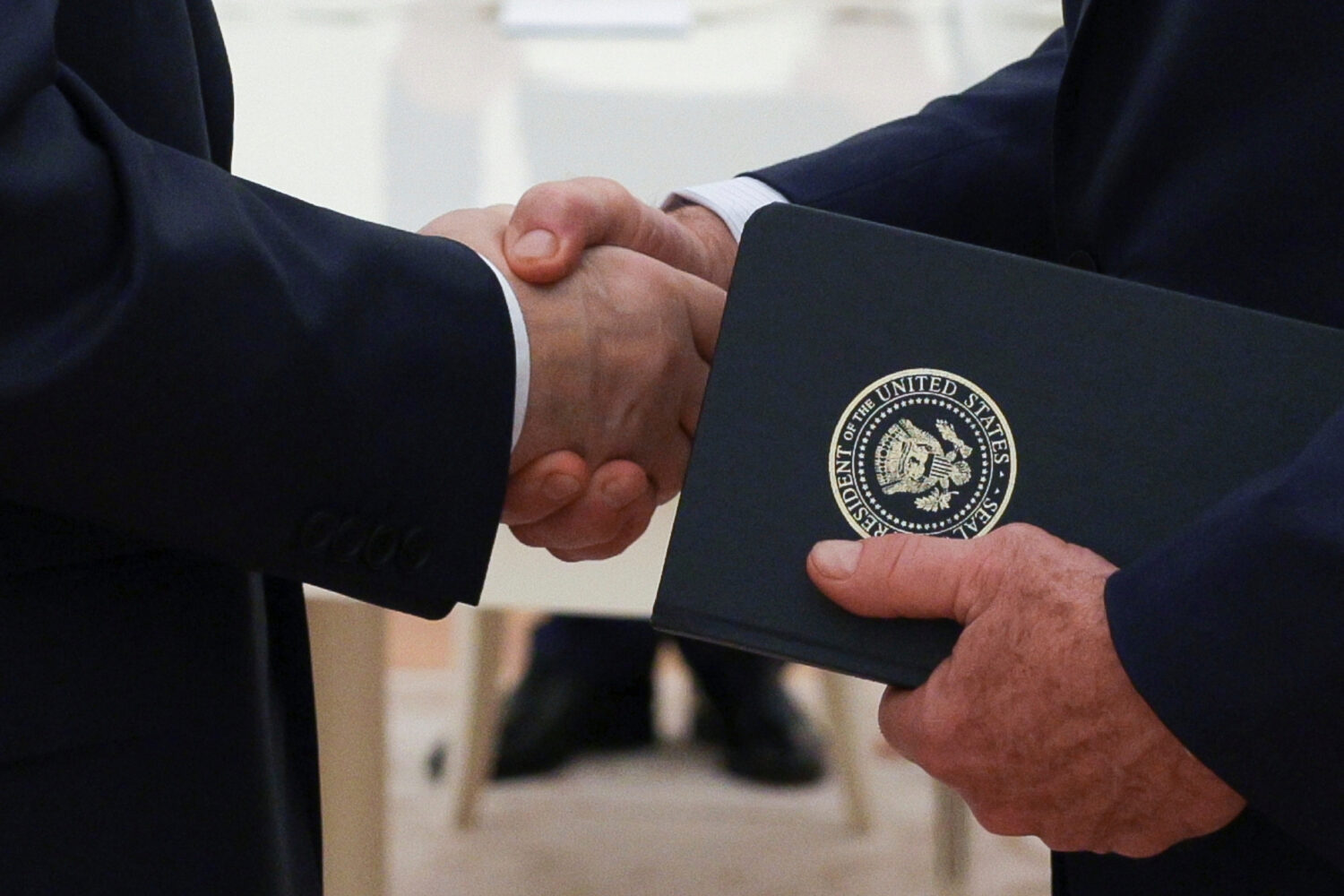 FILE - Russian President Vladimir Putin and U.S. President Donald Trump's special envoy Steve Witko...