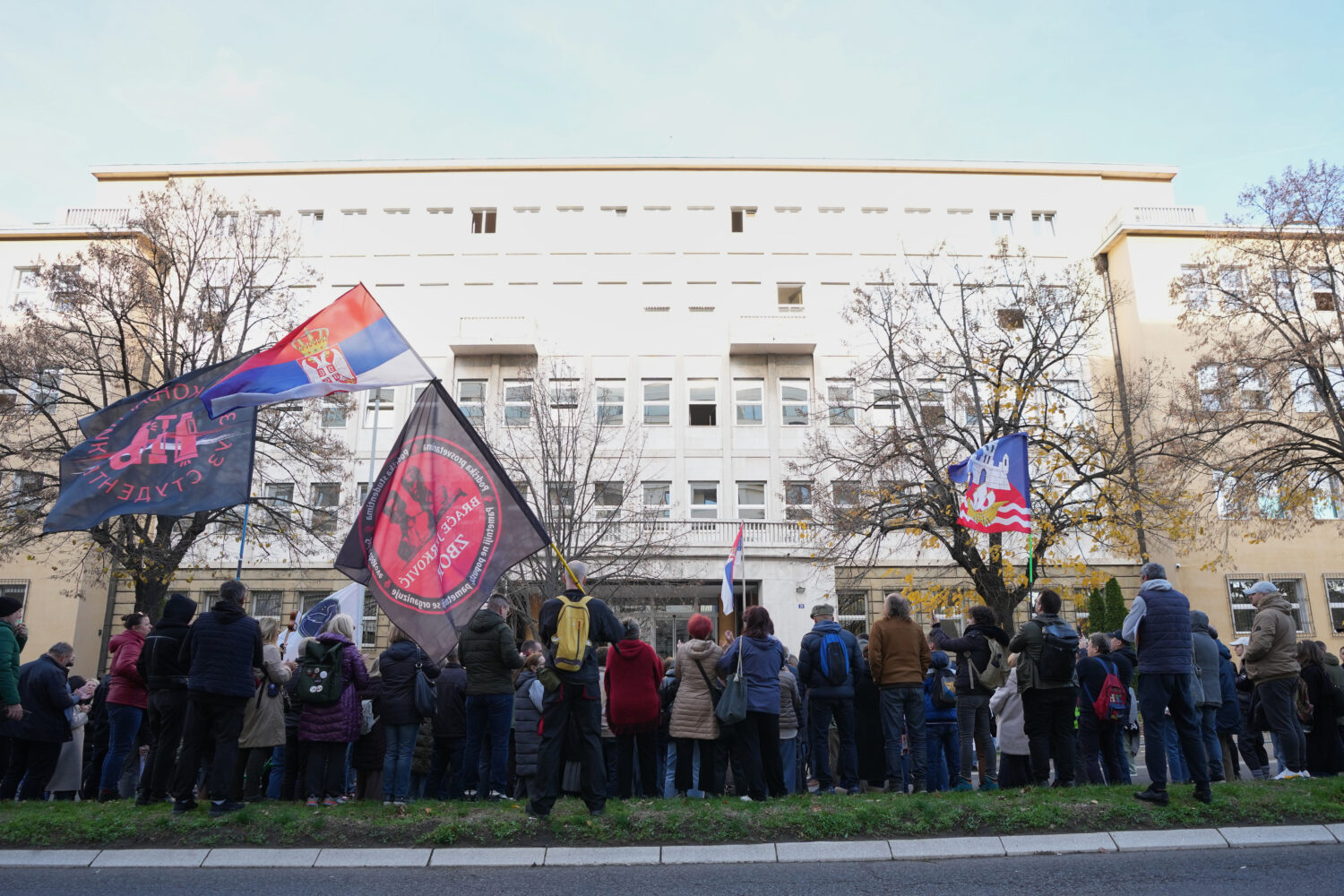 People attend a protest in front of a prosecutor's office for organized crime after Serbian lawmake...