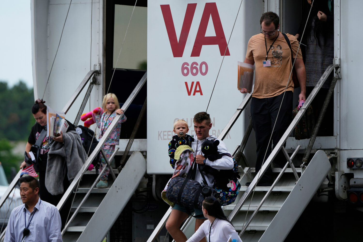 FILE - Refugees from South Africa, arrive Monday, May 12, 2025, at Dulles International Airport in ...