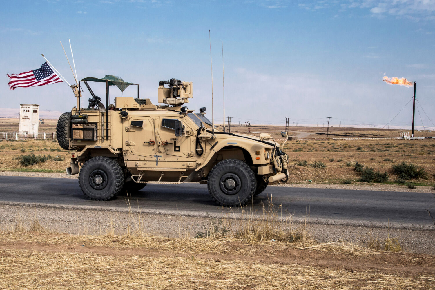 FILE - U.S. forces patrol oil fields in Syria, Oct. 28, 2019 . (AP Photo/Baderkhan Ahmad, File)Cred...