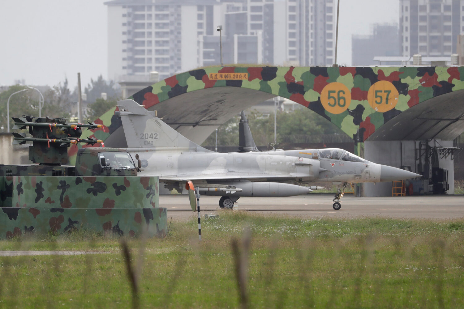 A Taiwan's Mirage 2000 fighter jet runs past an airplane fort at an airbase in Hsinchu, northern Ta...