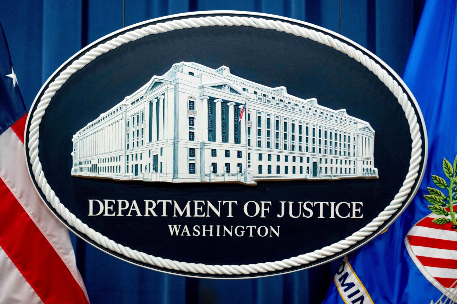 FILE - The Justice Department sign is shown in Washington, Nov. 18, 2022. (AP Photo/Andrew Harnik, ...