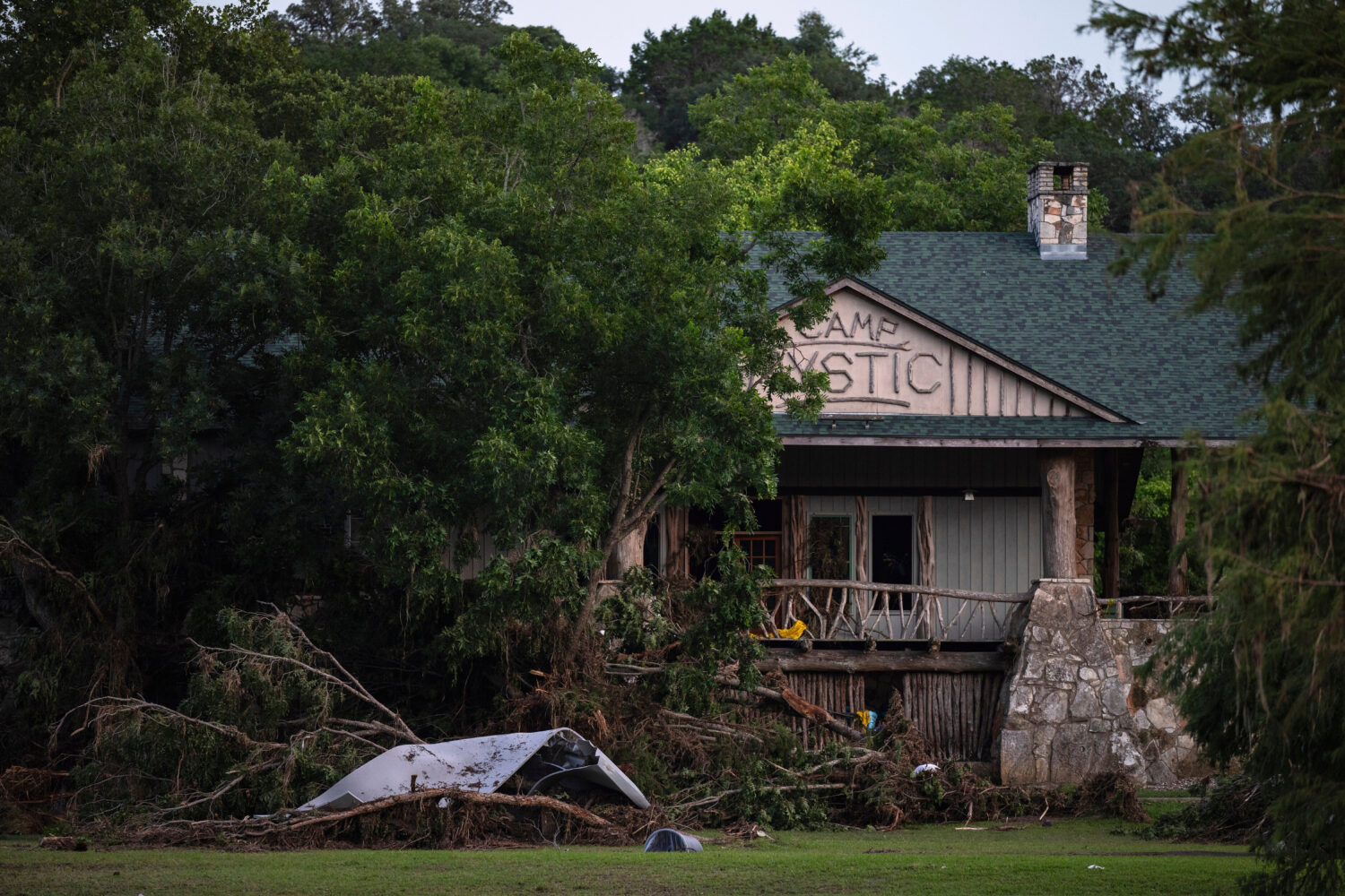 FILE - Debris covers the area of Camp Mystic in Hunt, Texas, July 7, 2025, after a flash flood swep...