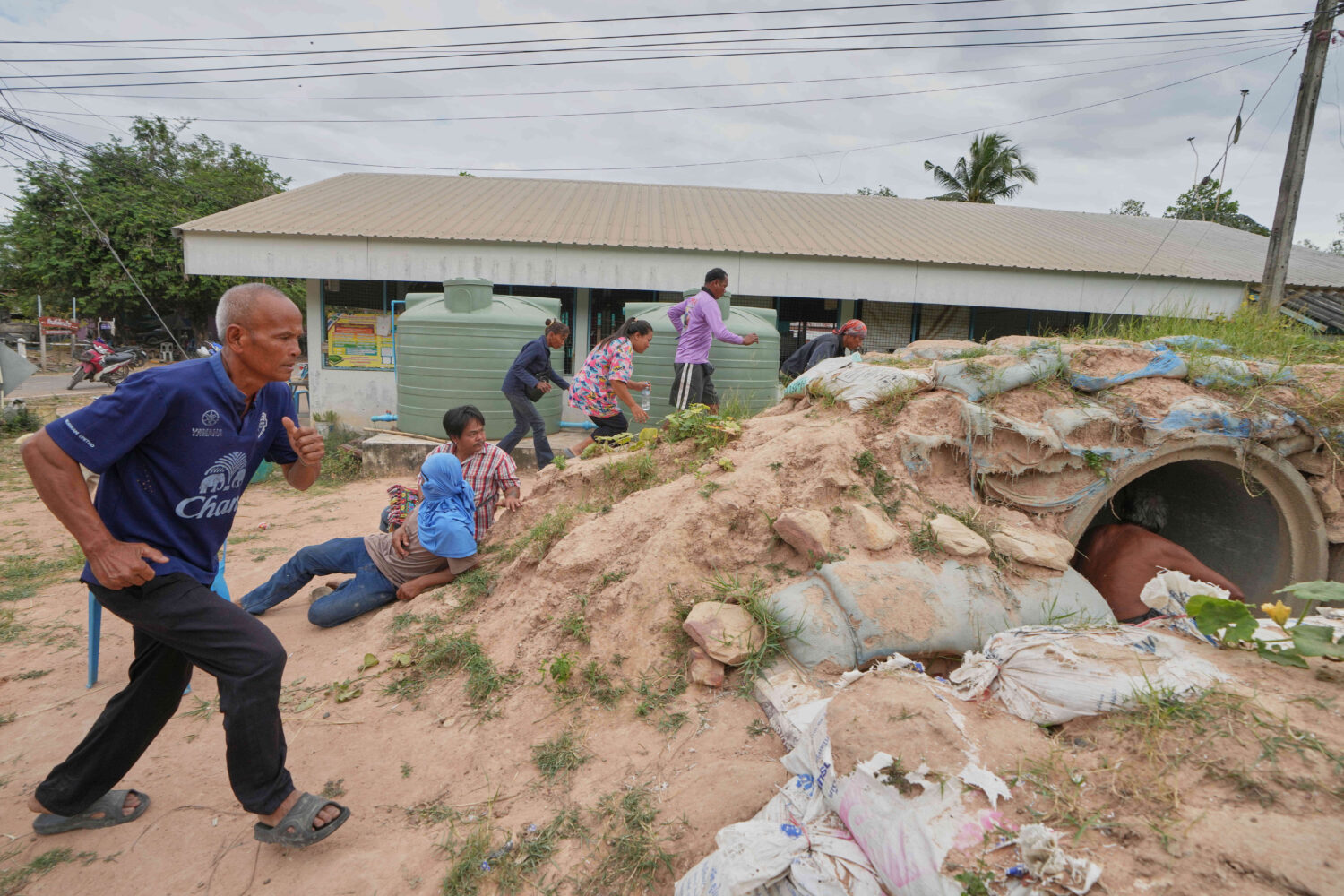 Village security volunteers and resident run into shelter while the blasts sounded too close in Bur...