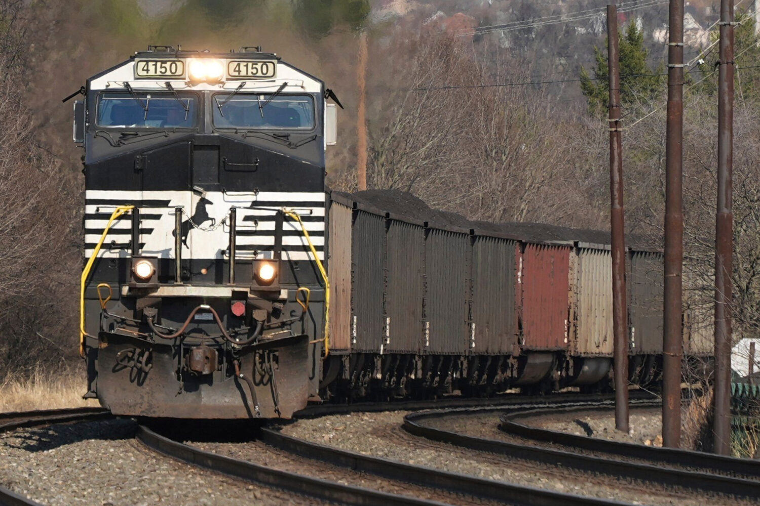 FILE - A Norfolk Southern freight train passes through Homestead, Pa., March 12, 2025. (AP Photo/Ge...
