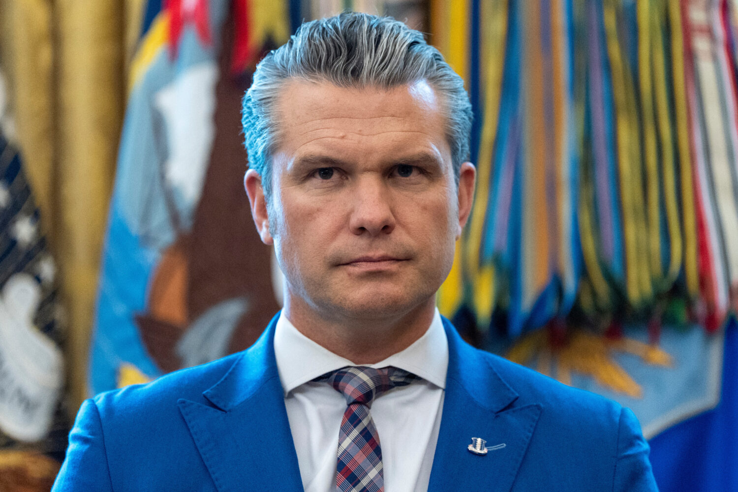 Defense Secretary Pete Hegseth listens as President Donald Trump speaks during a Mexican Border Def...