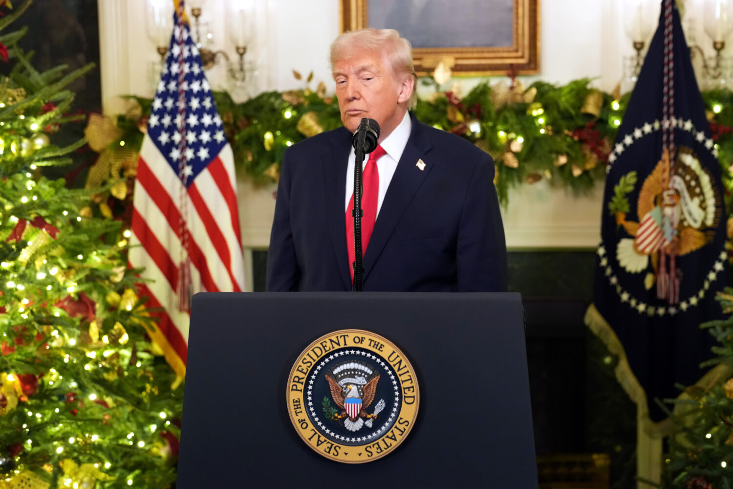 President Donald Trump finishes his remarks in an address to the nation from the Diplomatic Recepti...