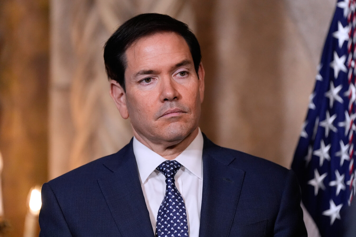 Secretary of State Marco Rubio listens as President Donald Trump speaks at his Mar-a-Lago club, Mon...