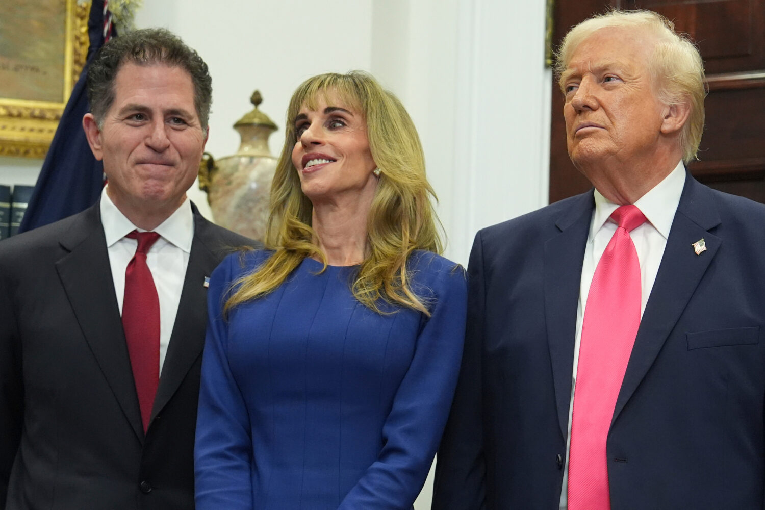 Michael Dell, left, his wife Susan and President Donald Trump listen during an event on "Trump Acco...