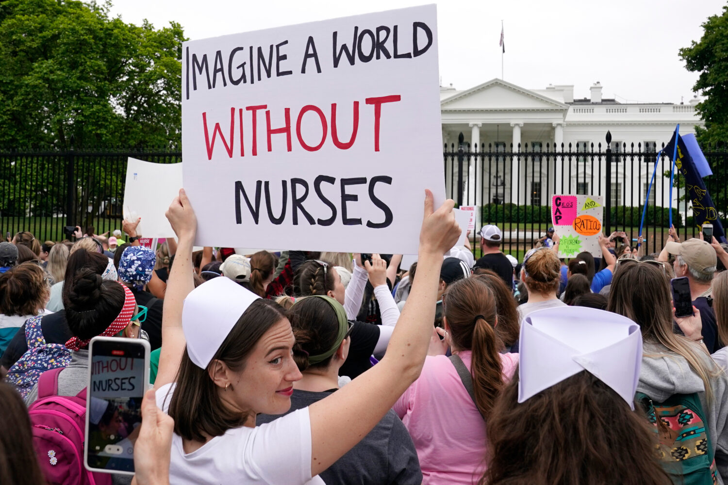 FILE - People protest outside the White House in Washington, May 12, 2022. (AP Photo/Susan Walsh)Cr...
