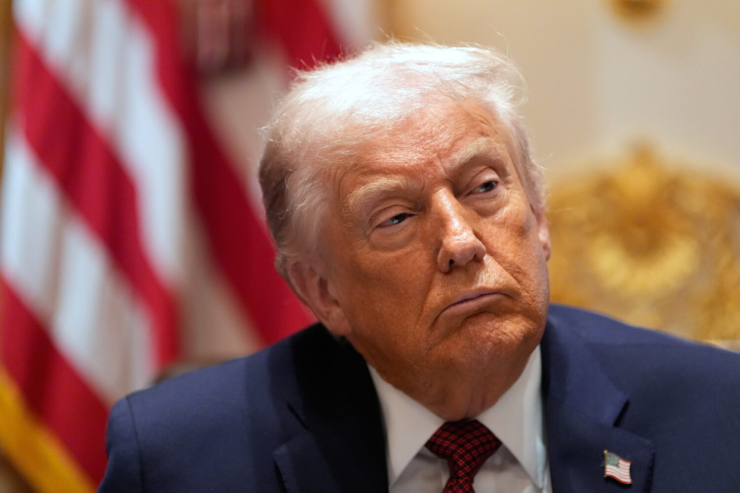 President Donald Trump listens during a roundtable on farm subsidies in the Cabinet Room of the Whi...