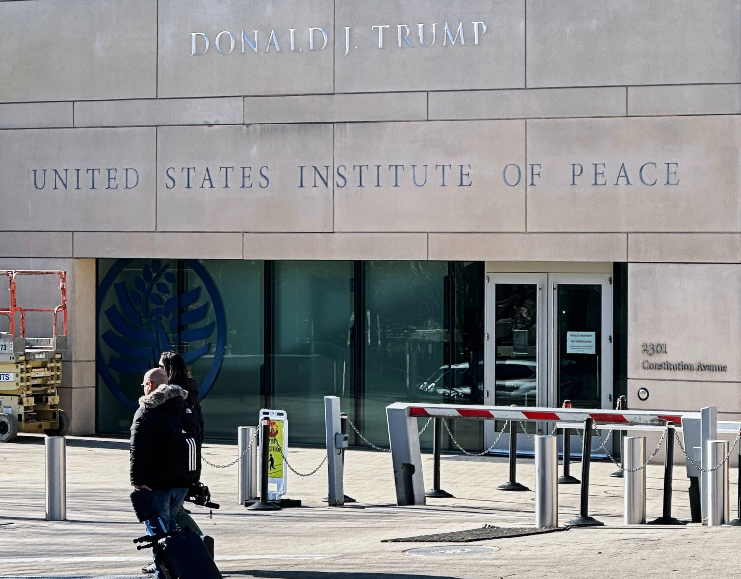 President Donald Trump's name is seen on the United State Institute of Peace building, Wednesday, D...