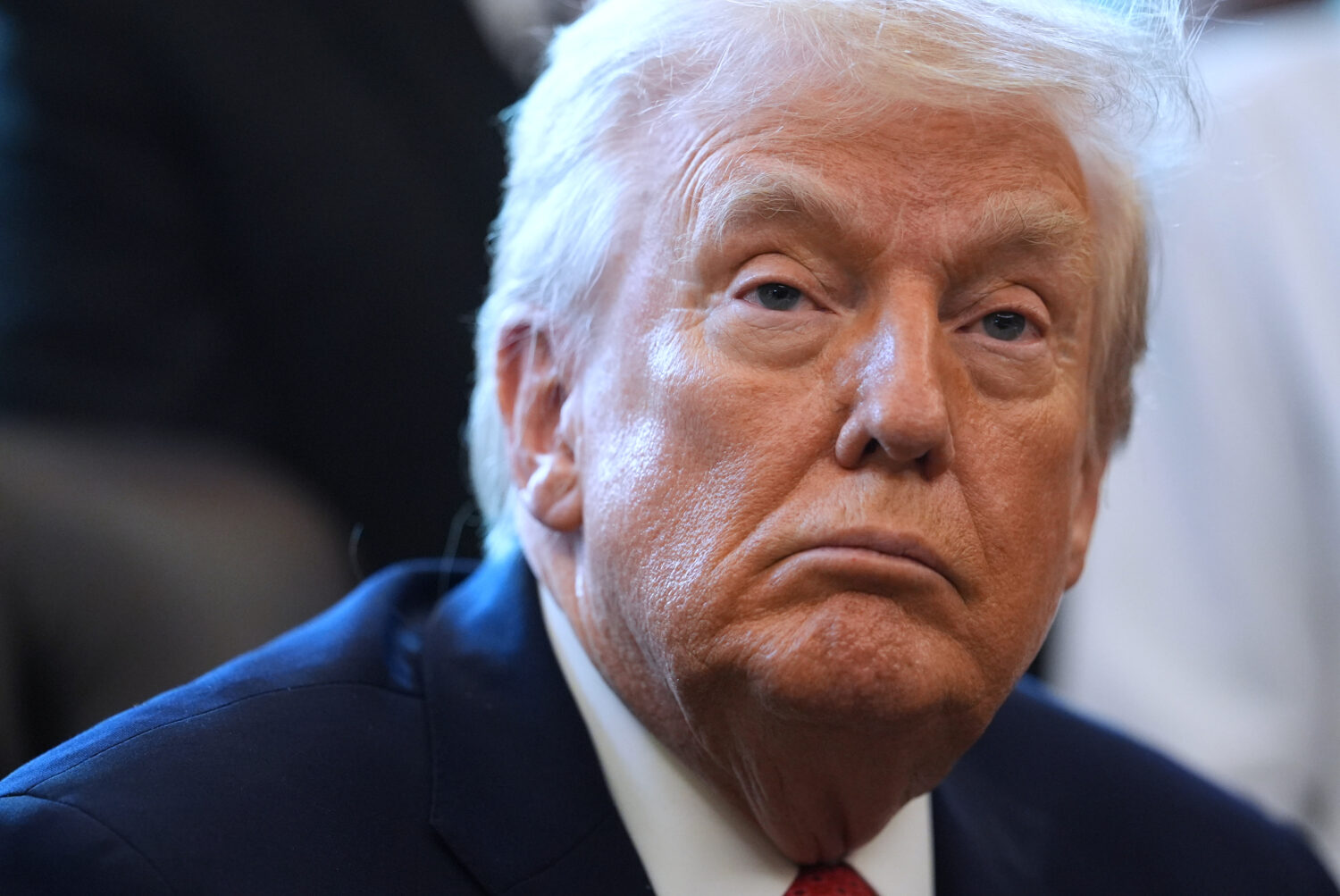 President Donald Trump listens before he signs an executive order reclassifying marijuana as a less...