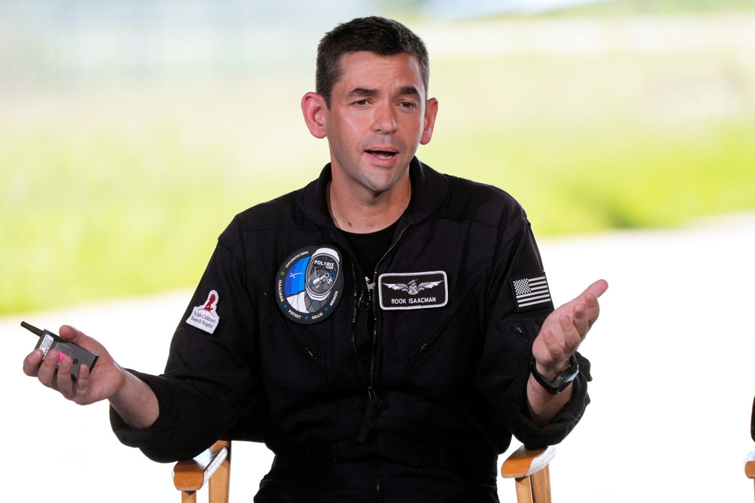 FILE - Commander Jared Isaacman speaks at a news conference after arriving at the Kennedy Space Cen...