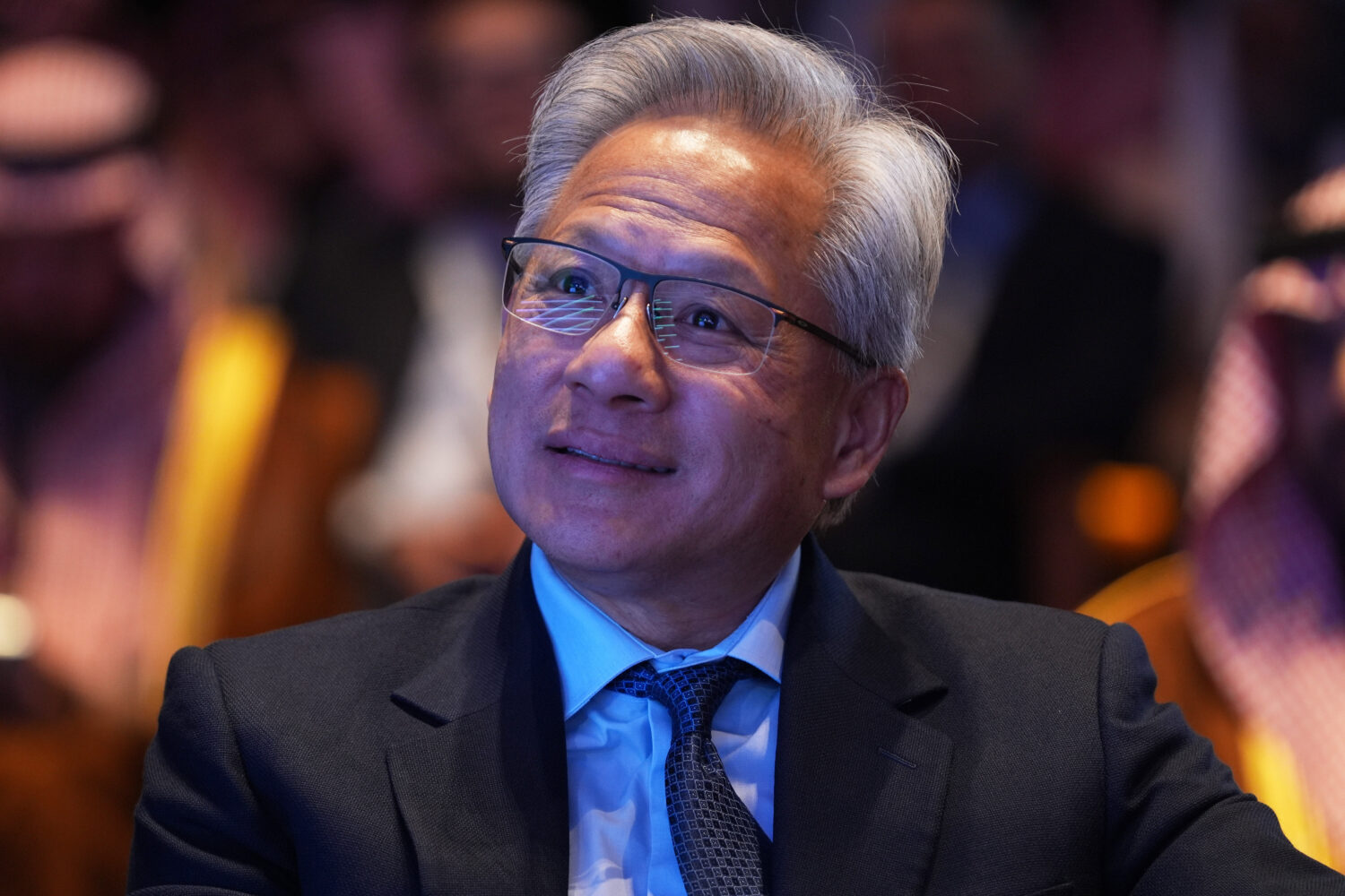 Nvidia CEO Jensen Huang listens as President Donald Trump speaks during the Saudi Investment Forum ...