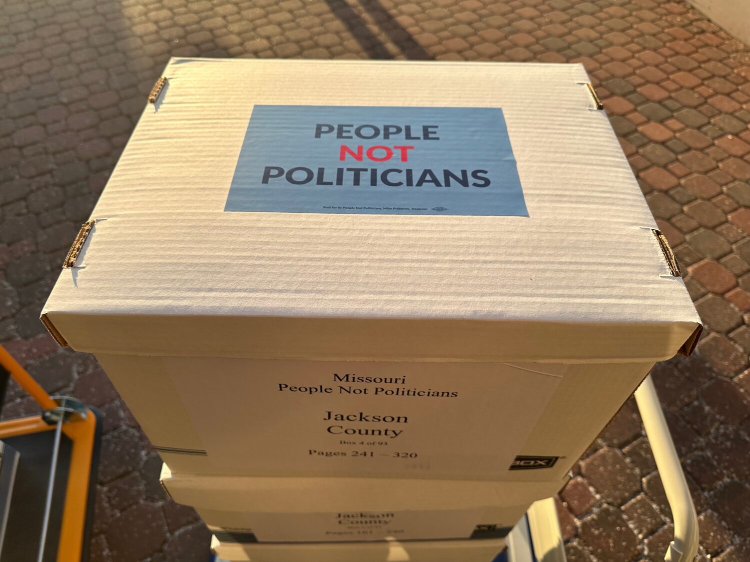 Boxes of petition signatures are stacked up to be delivered Tuesday, Dec. 9, 2025, to the secretary...