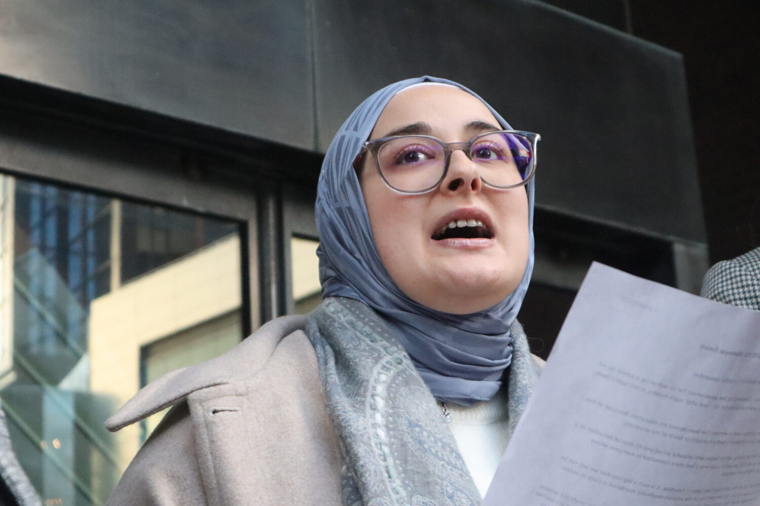 Tufts University doctoral student Rumeysa Ozturk reads from a prepared statement following a court ...