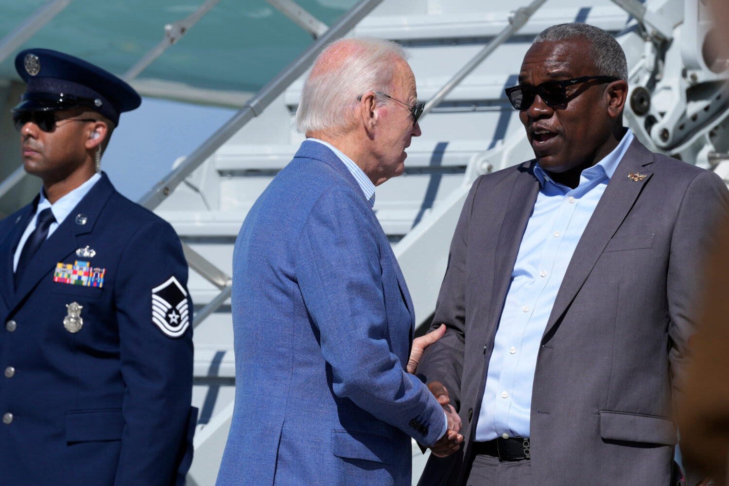 FILE - President Joe Biden, center, greets Virgin Islands Gov. Albert Bryan, Jr., right, before boa...