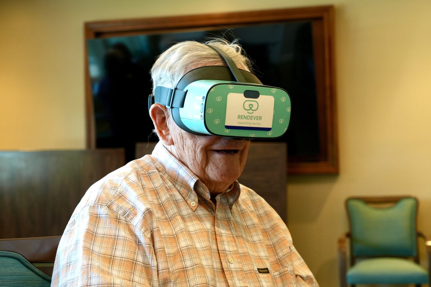 Jim Holtshouse watches video through a Rendever virtual-reality headset at the Forum at Rancho San ...