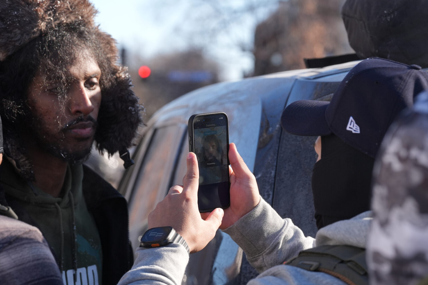 ADDS REFERENCE TO FACIAL RECOGNITION APP - Federal agents use a facial recognition app on a person ...