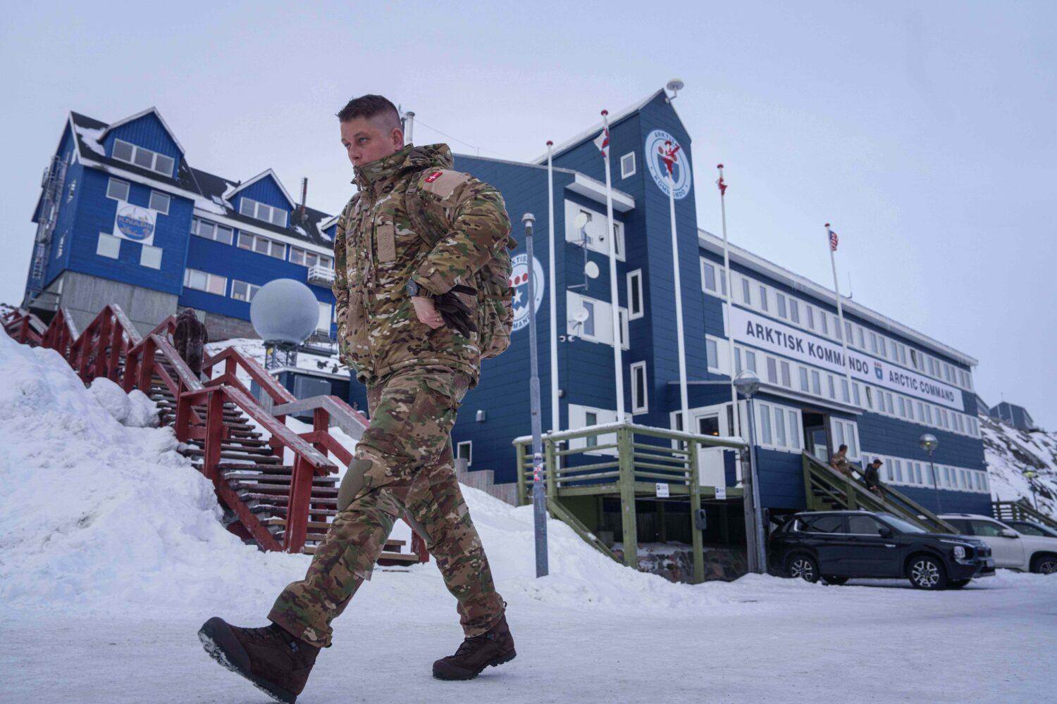 A Danish serviceman walks in front of Joint Arctic Command center in Nuuk, Greenland, on Friday, Ja...