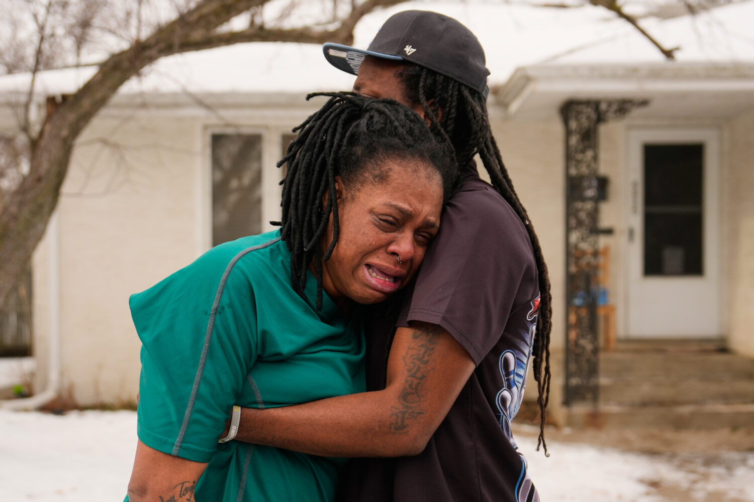 A family member reacts after federal immigration officers make an arrest Sunday, Jan. 11, 2026, in ...