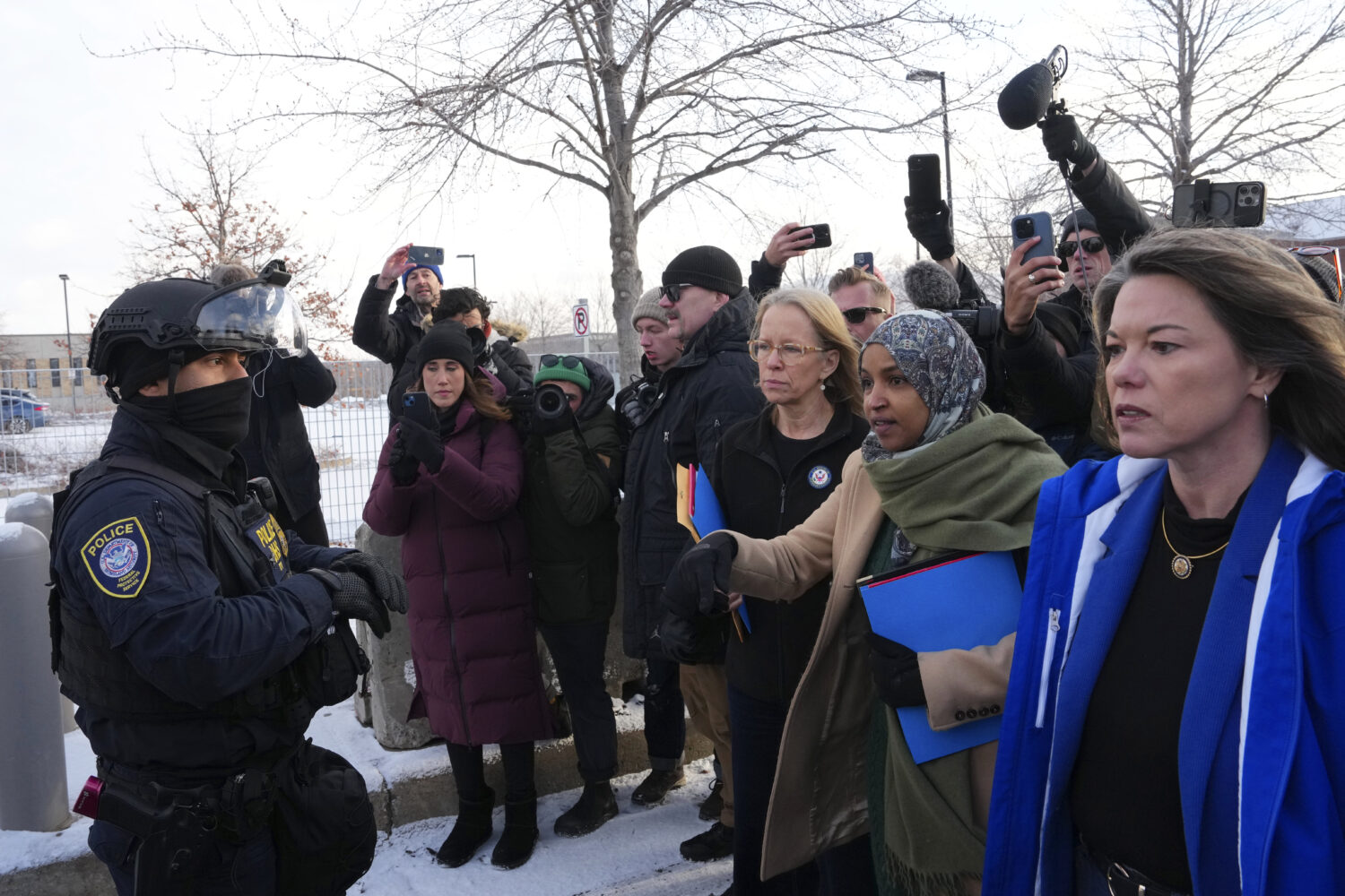 Rep. Kelly Morrison D-Minn., center, Rep. Ilhan Omar, D-Minn., second from the right, and Rep. Angi...
