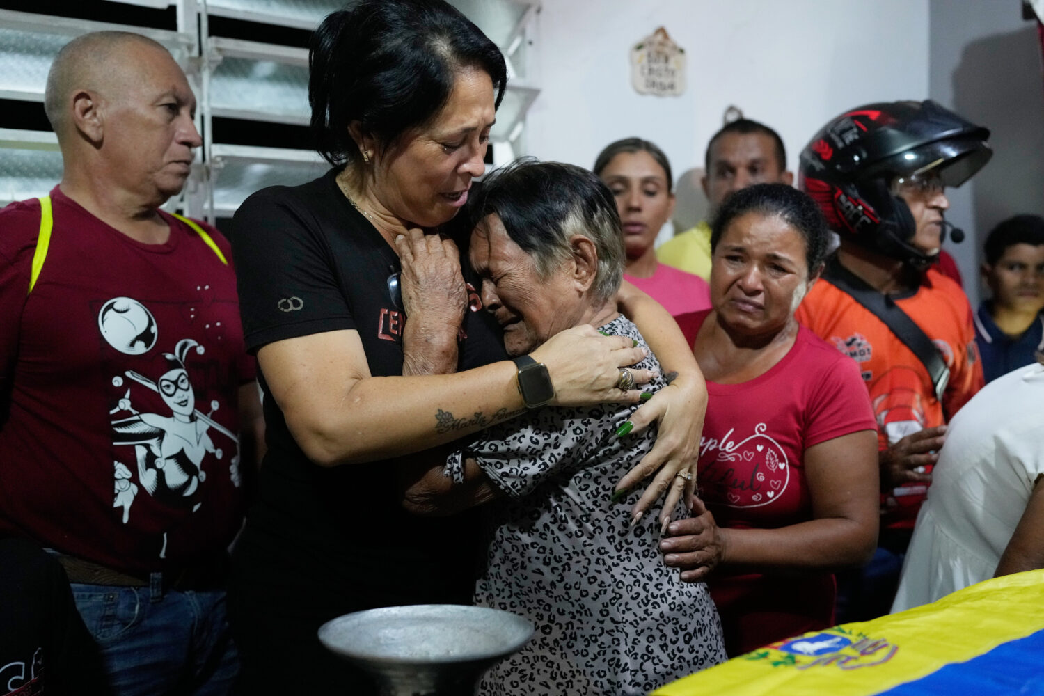 Emelyn Torres and Maria Cristina Fernandez, the sister and grandmother of Edilson Torres, a Venezue...