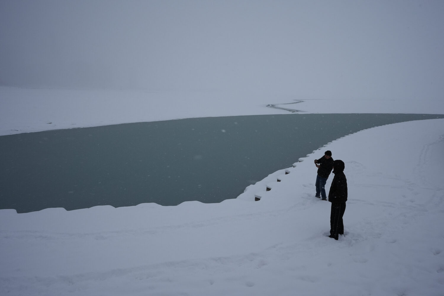 People take photos at Lake Michigan in Chicago, Sunday, Jan. 25, 2026. (AP Photo/Nam Y. Huh)Credit:...