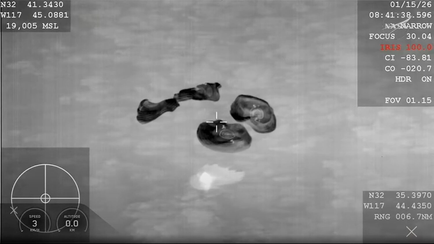 This screengrab from video provided by NASA shows the NASA's SpaceX Crew-11 members re entering the...