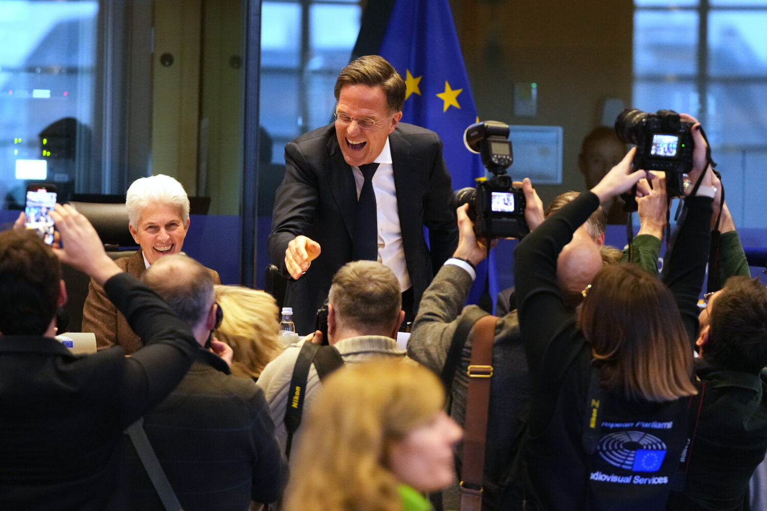 NATO Secretary General Mark Rutte, center, greets the audience prior to his address during the Secu...