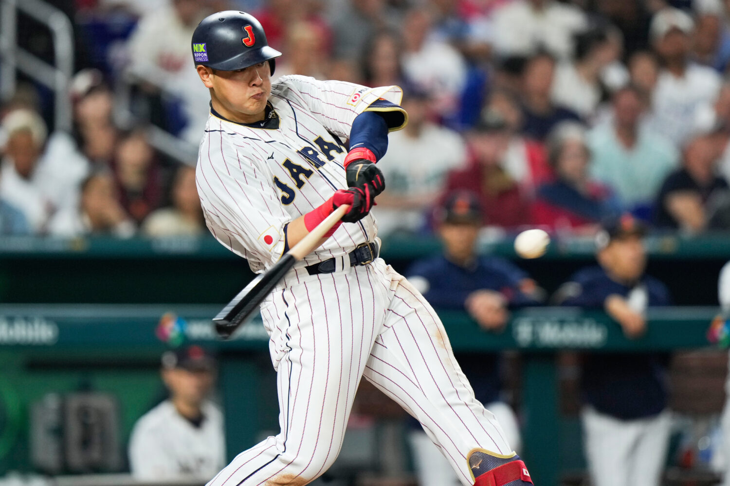FILE - Japan's Kazuma Okamoto hits a home run during fourth inning of a World Baseball Classic cham...