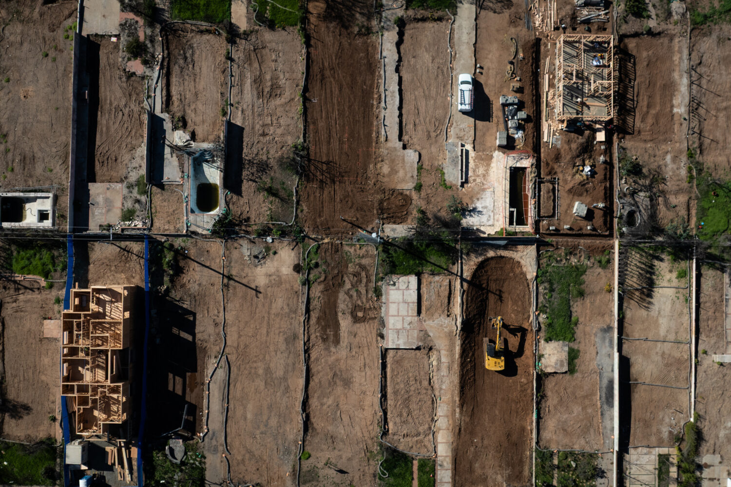 FILE - An aerial view shows houses being rebuilt on cleared lots months after the Palisades Fire, D...