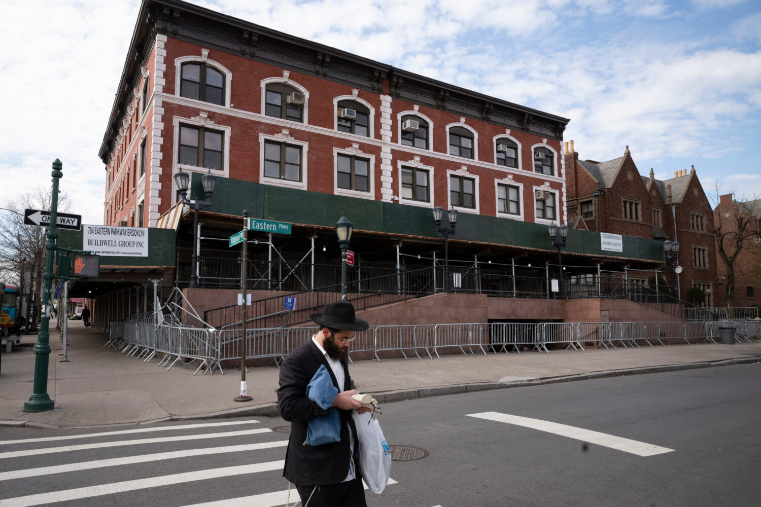 FILE - A man passes the Chabad-Lubavitch World Headquarters in the Crown Heights neighborhood of Br...