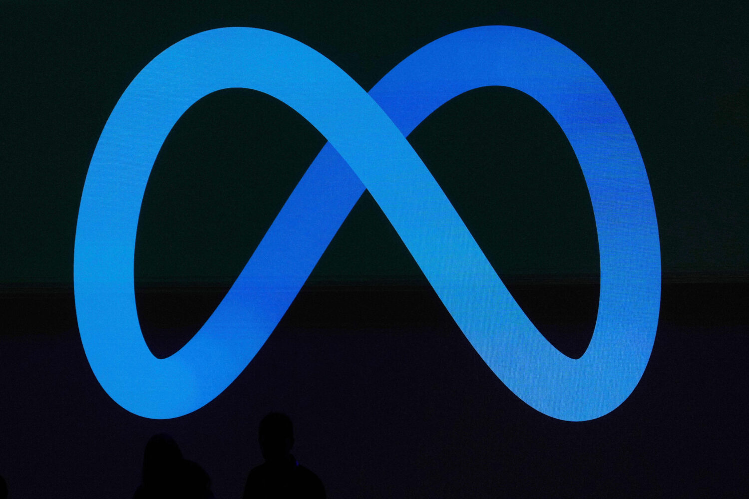 FILE -A Meta logo is shown on a video screen at LlamaCon 2025, an AI developer conference, in Menlo...