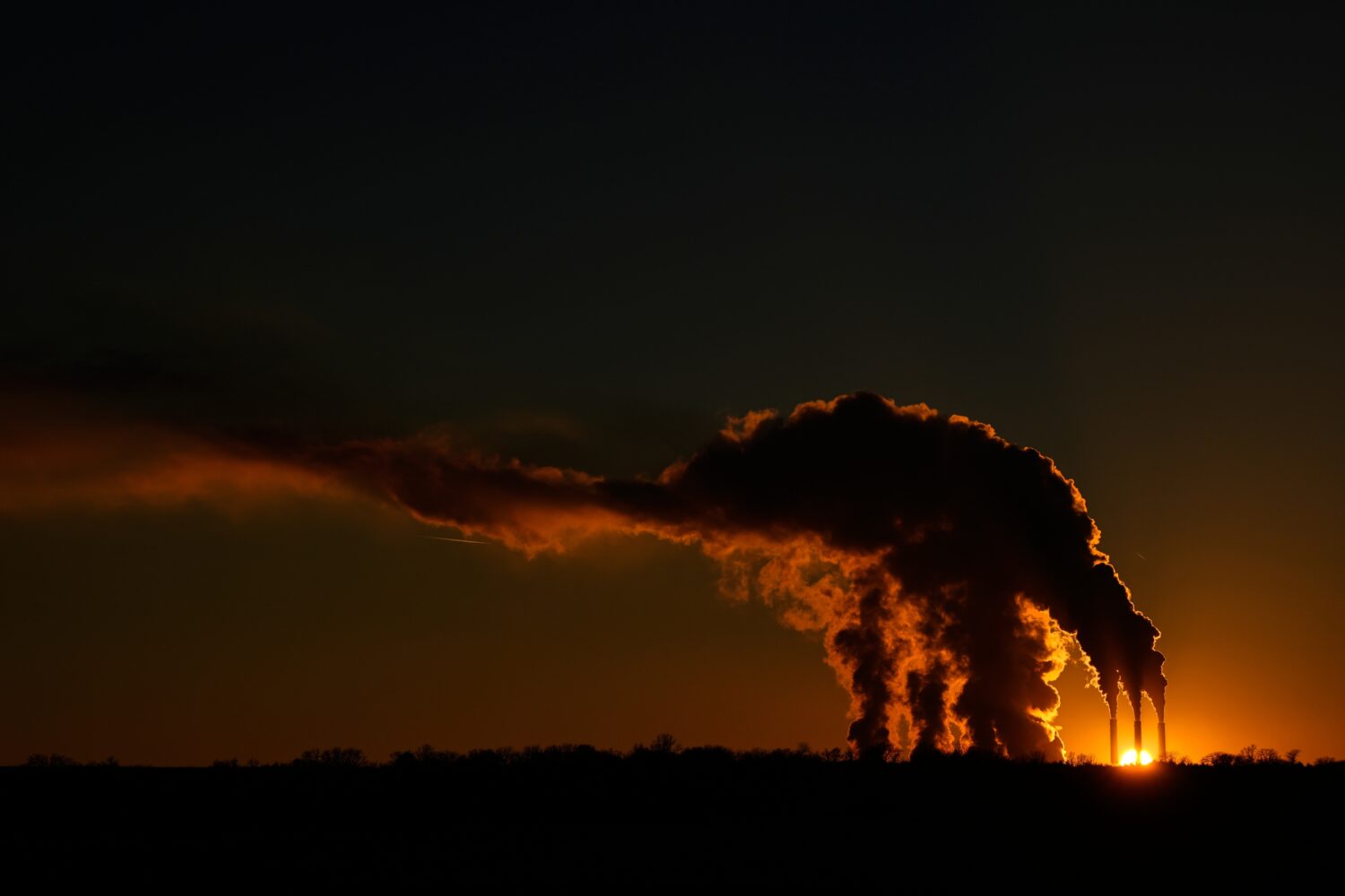 The Jeffrey Energy Center coal-fired power plant operates at sunset near Emmett, Kan., Saturday, Ja...