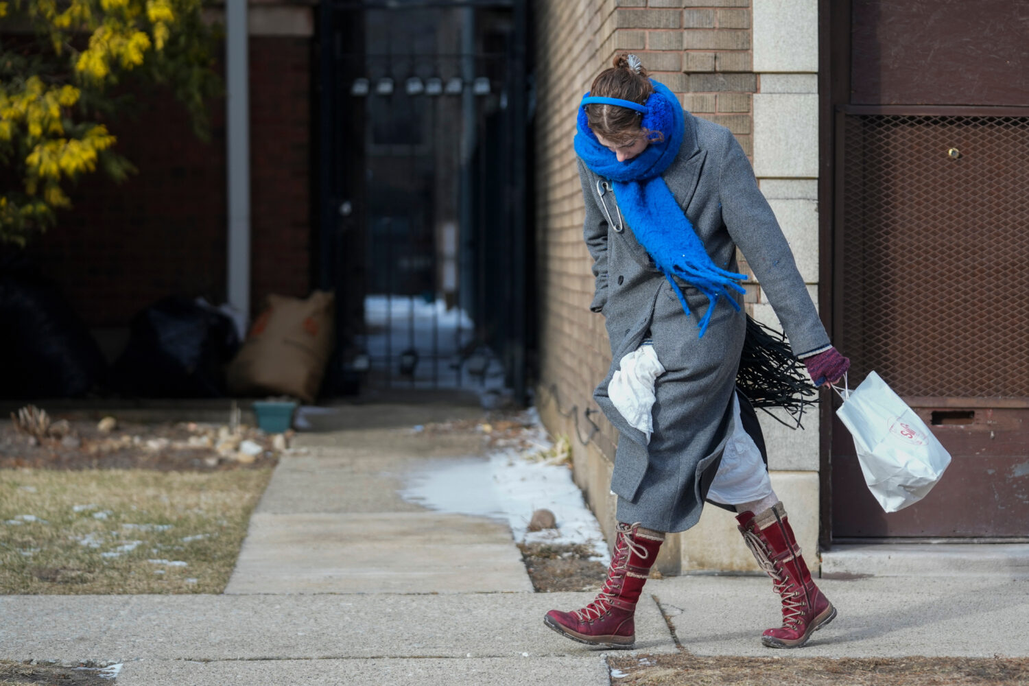 A person walks in the cold and wind Wednesday, Jan. 21, 2026, in Chicago. (AP Photo/Erin Hooley)Cre...