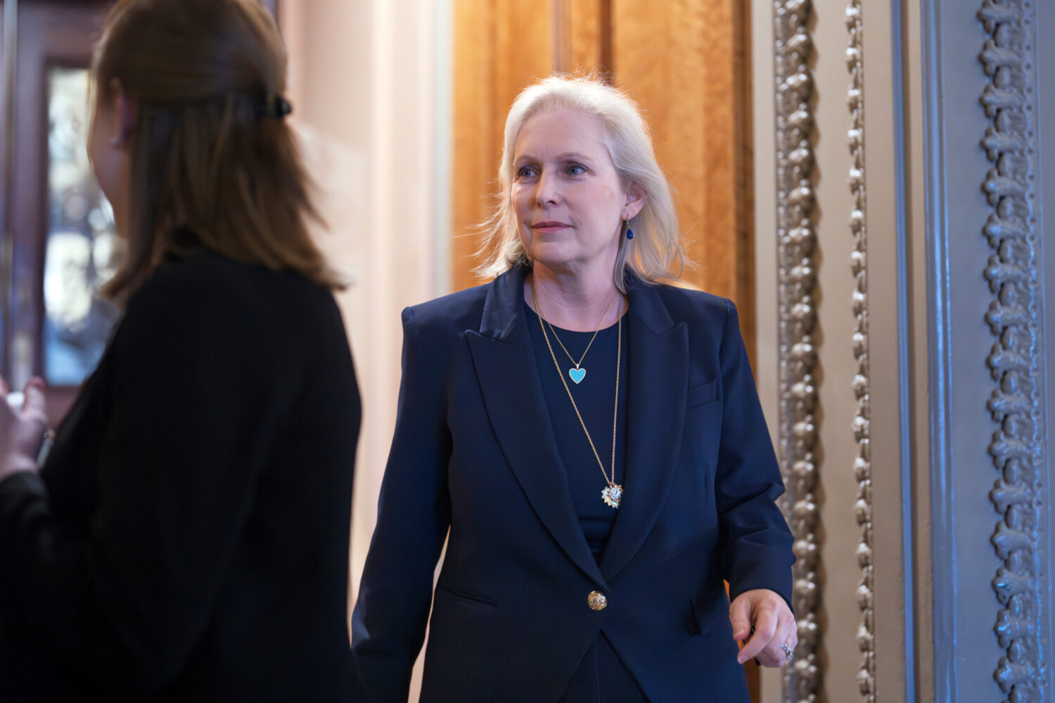 FILE - Sen. Kirsten Gillibrand, D-N.Y., leaves the Senate chamber after voting on a government fund...