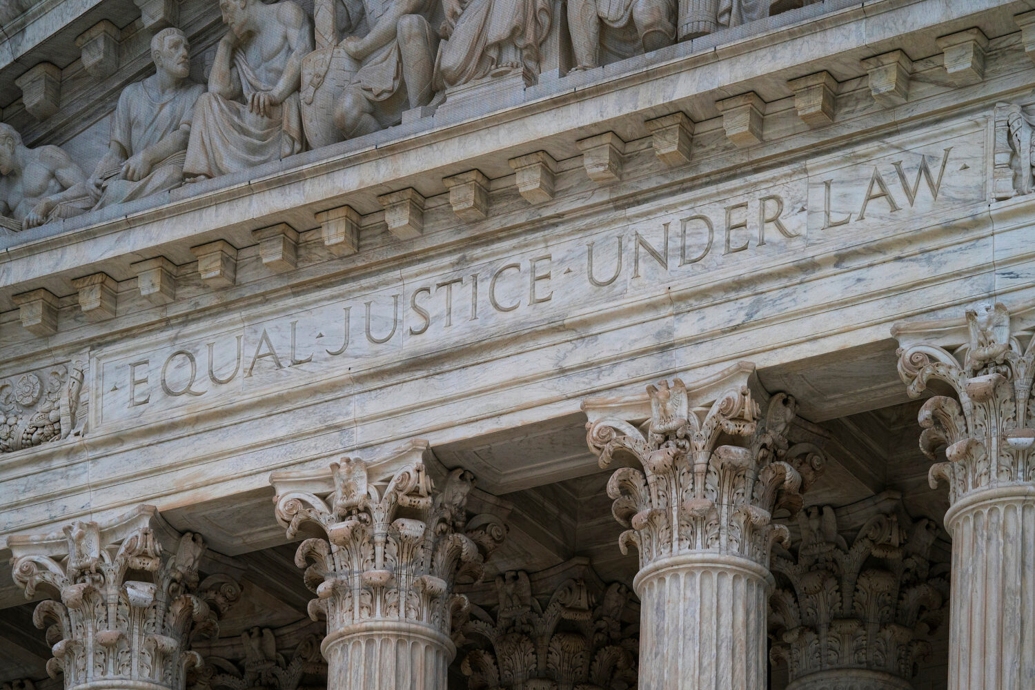 FILE - The west facade of the Supreme Court Building bears the motto "Equal Justice Under Law" on M...
