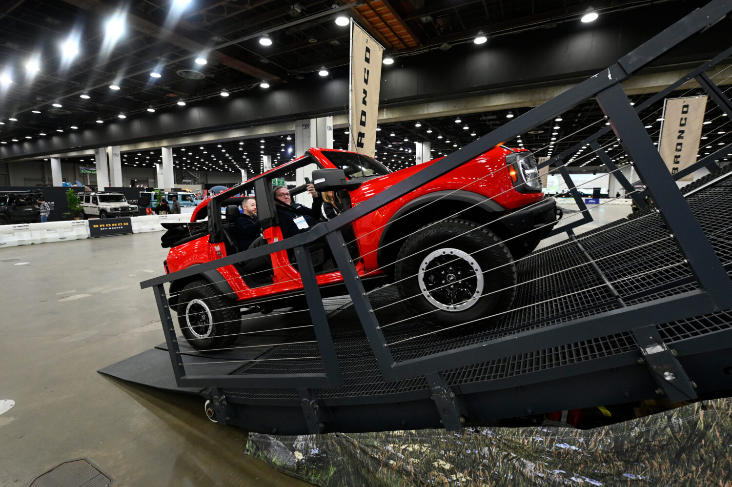FILE - Guests are given a ride in a Bronco on a track at the Detroit Auto Show, Friday, Jan. 10, 20...