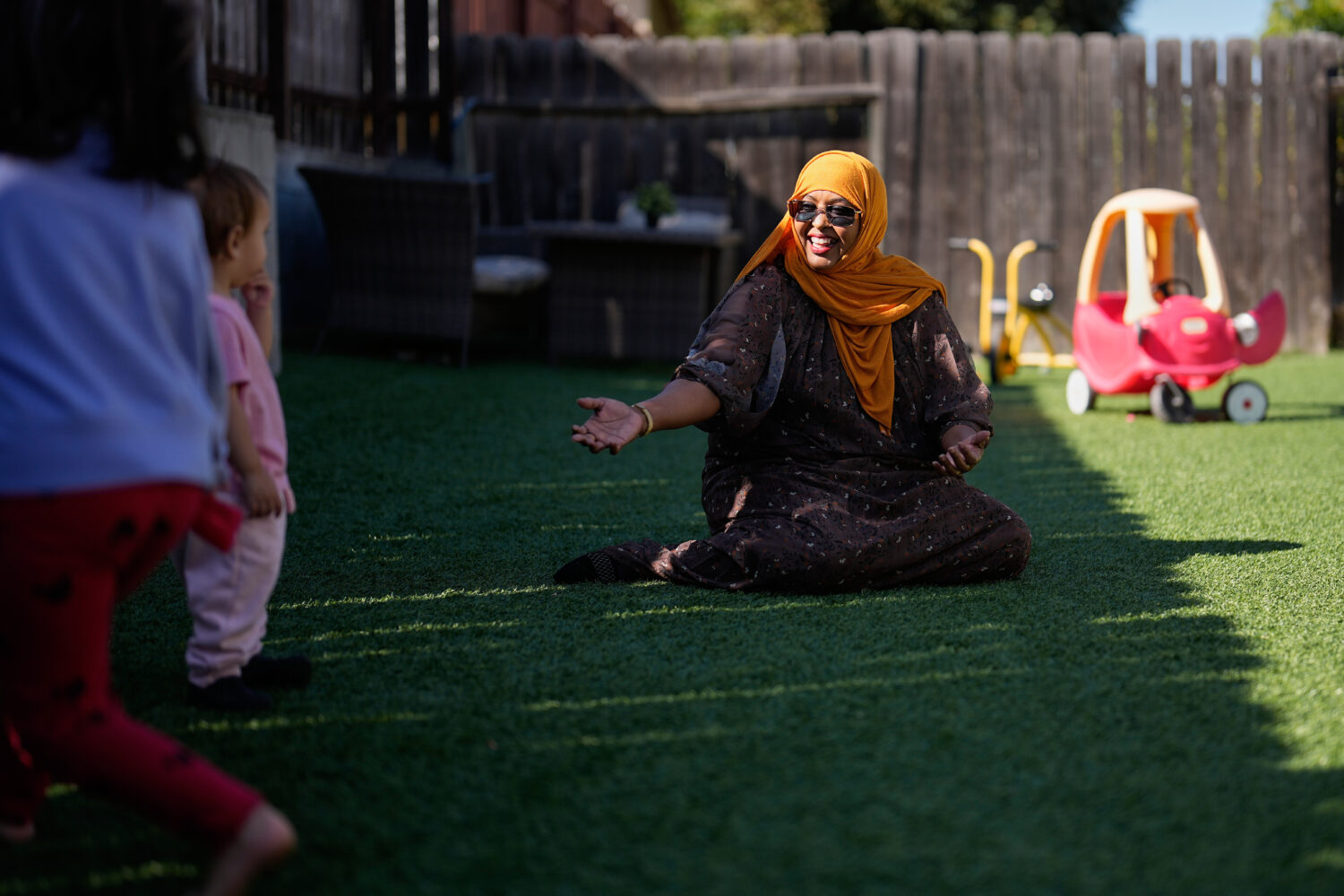 Samsam Khalif plays with children at her home-based child care center Friday, Jan. 30, 2026, in San...