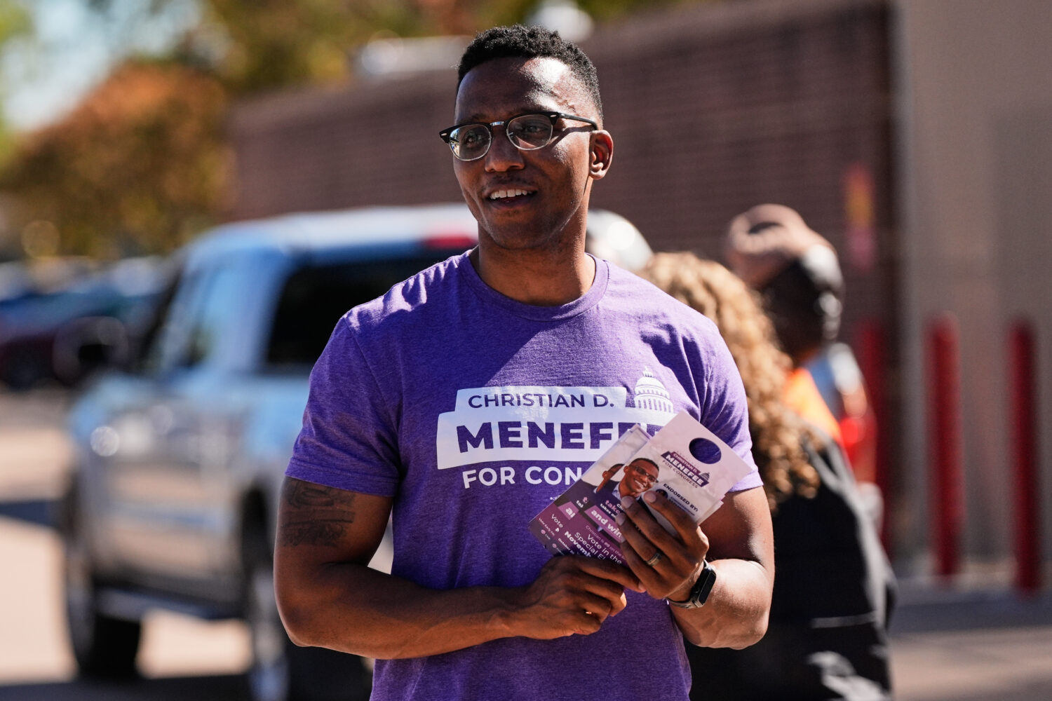FILE - Democratic 18th Congressional District candidate Christian Menefee greets voters near a poll...