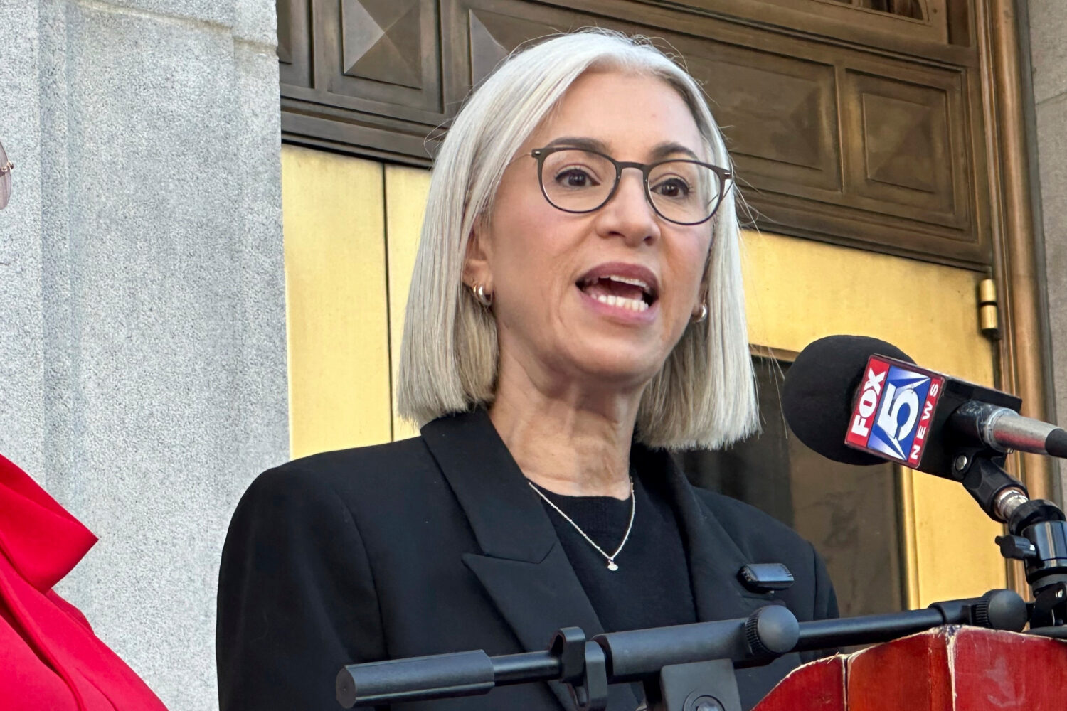 FILE - Fulton County Commissioner Dana Barrett speaks outside the Fulton County courthouse in Atlan...